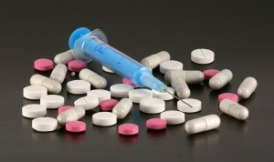 Syringe, tablets and pills